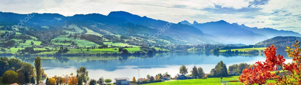Panoramic landscape of lake Gruyere in Switzerland. Canton Fribourg, Switzerland     