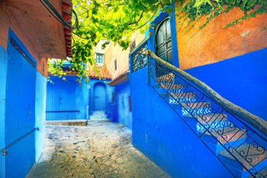 Street with blue coloured houses in old medina of Chefchaouen. Morocco,  North Africa clipart