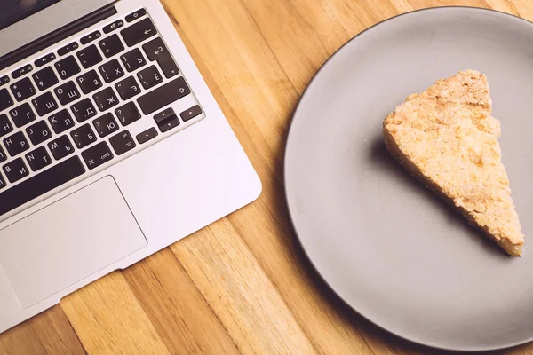 Gray laptop on a wooden table. Copy space. — Stock Photo, Image