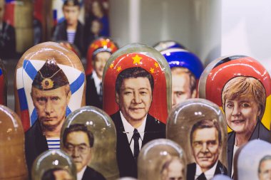 Putin, Xi Jinping and Angela Merkel in the form of Russian nesti clipart