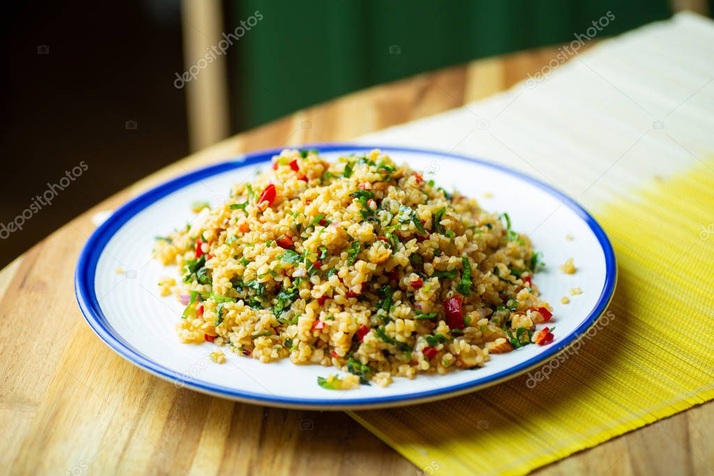 Homemade vegan food (vegan salad) from bulgur cereal with fresh 