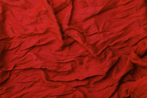 Red fabric background. Texture and folds of red fabric, copy spa — Stock Photo, Image