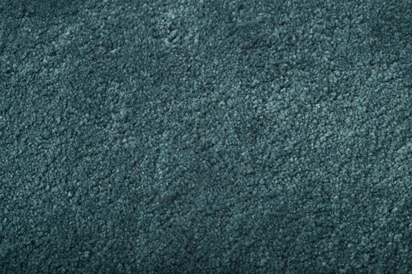 Tapijtbedekking achtergrond. Patroon en textuur van blauw tapijt. — Stockfoto