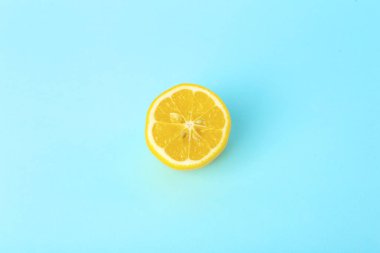 Summer and vitamins background. Lemon on a blue background, mini clipart