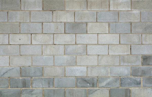 Grå tegel betong vägg bakgrund. Textur av betongtegel — Stockfoto