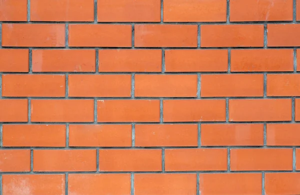 Alvenaria ou nova parede de tijolo limpo. Textura e modelo de um tijolo — Fotografia de Stock