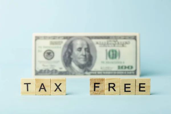 Tax free concept on a background of dollars. Tax-free purchase a
