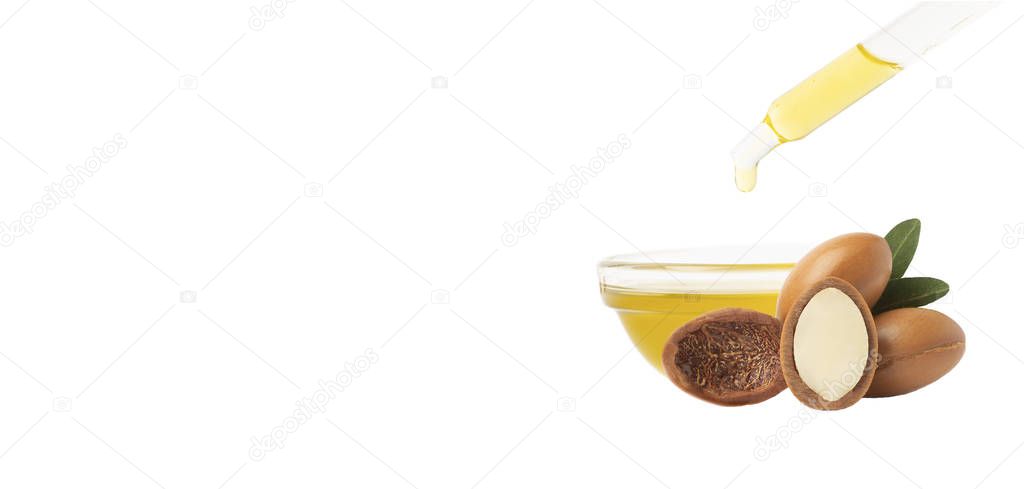 Argan oil isolated. Argan seeds with oil on a white background. 