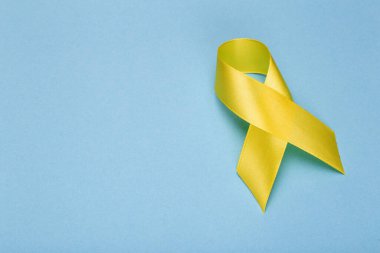 Sarı kurdele, Çocukluk Kanser Farkındalığı Ayı. Kanser ya da intihar önleme kurdelesi. Çocuk sağlığı geçmişi. Boşluğu kopyala.