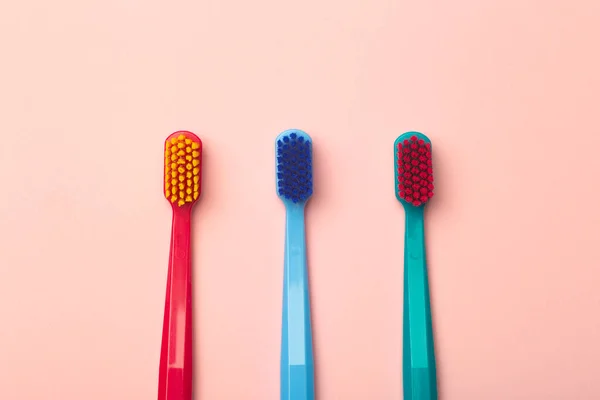 Toothbrushes Different Colors Pink Background Brushing Teeth Oral Hygiene — Stock Photo, Image