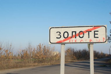 Zolote city road sign in Donbass, Eastern Ukraine clipart