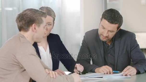 Businesspeople checking a contract   in office — Stock Video