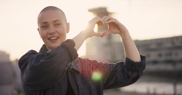 Young Woman Buzz Cut Making Hearth Her Hands Sunlight — Stock Video