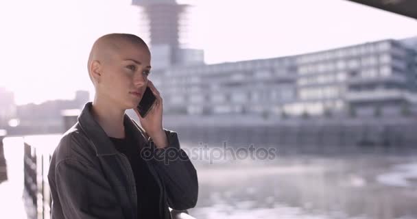 Beautiful Girl Buzz Cut Having Good Phone Call — стоковое видео