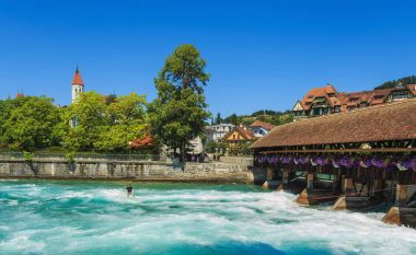 The Aare river in the city of Thun in Switzerland in summertime clipart
