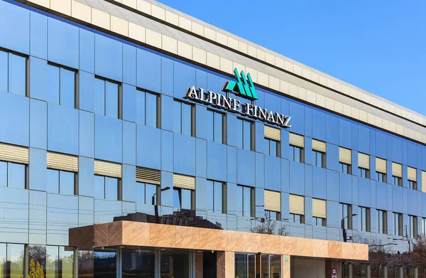 Office building bearing Alpine Finanz sign — Stock Photo, Image