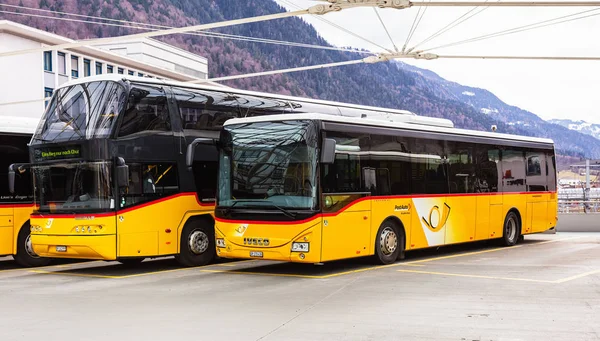 Post Buses at the bus station in the city of Chur in Switzerland — Stock Photo, Image