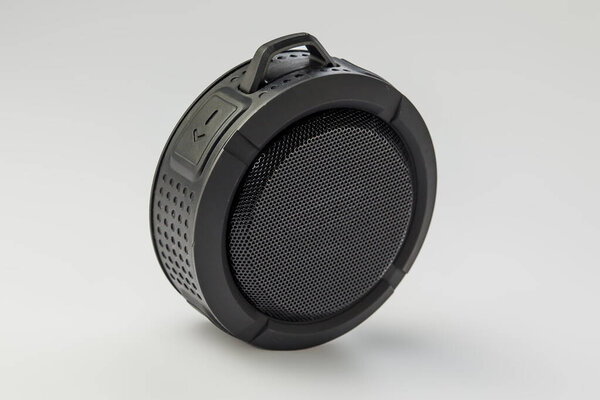Round Bluetooth speaker on white background isolate