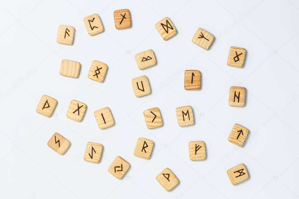 Wooden runes on white background isolate