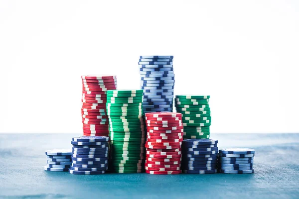 Stack of poker chips on the table on a white background isolate — Stock Photo, Image