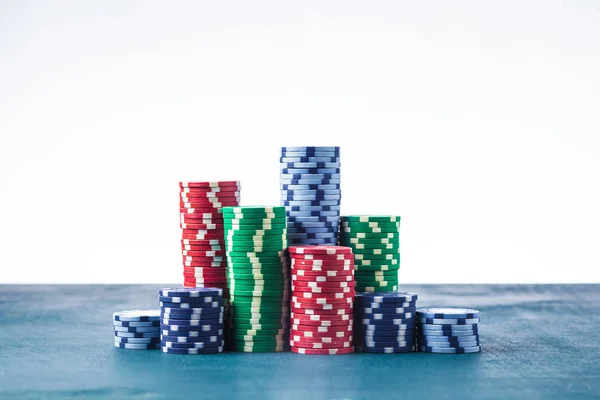 Stack of poker chips on the table on a white background isolate — Stock Photo, Image