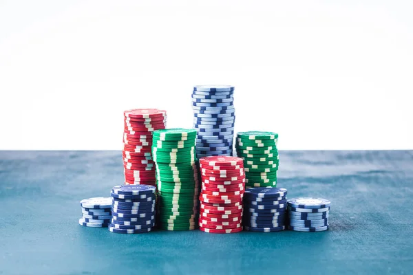 Stack of poker chips on the table on a white background isolate — Stock Photo, Image