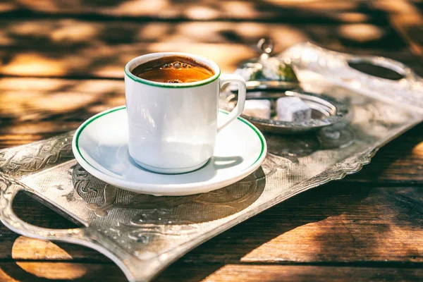 Turkish coffee in a white cup on a silver tray — Stock Photo, Image