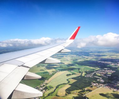 Wing of the aircraft, a view of the fields from above. Travel, f clipart