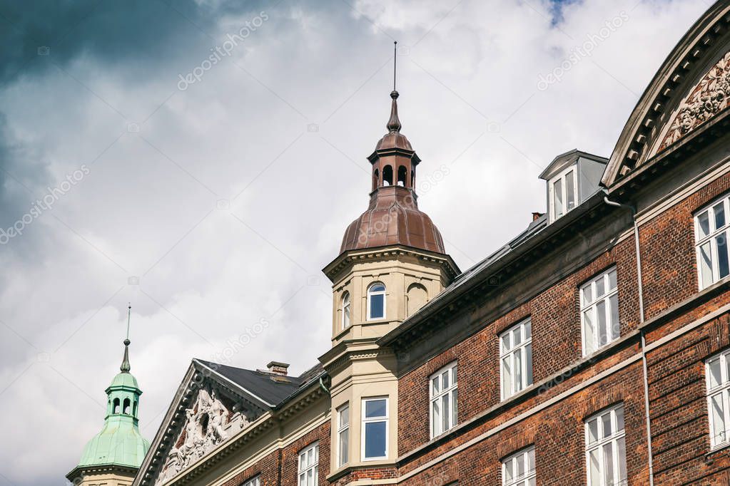 The facade of a historic building against a blue sky in Copenhag