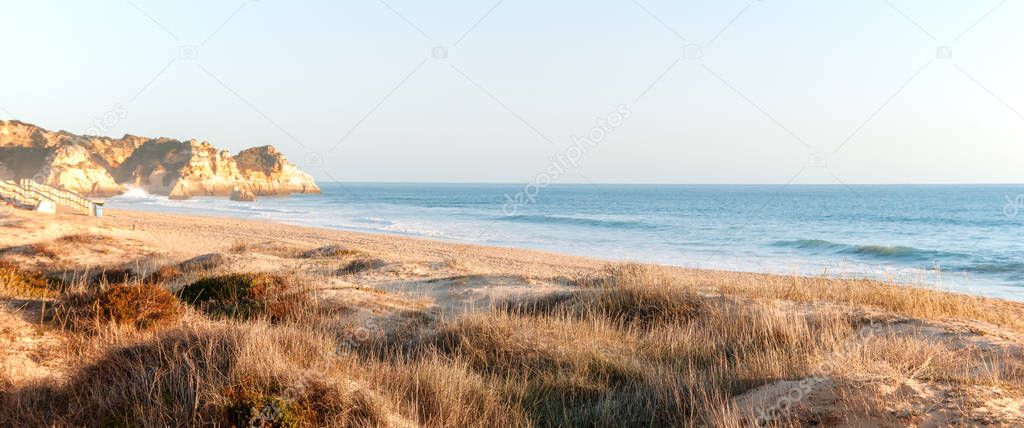 Beautiful seascape in pastel  tones, sand dunes and seashore, pa