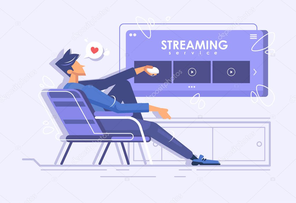 A young guy is sitting in a chair and watching a movie. Online movie theater. Streaming service concept. Online viewing of TV series at home.