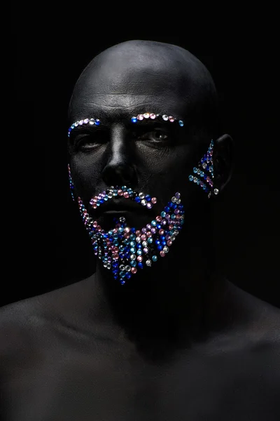 Man in paint and rhinestones