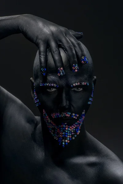 Man in paint and rhinestones — Stock Photo, Image