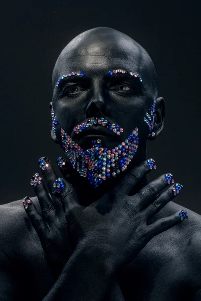 Man in paint and rhinestones — Stock Photo, Image