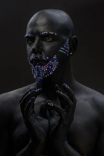 Man in paint and rhinestones — Stock Photo, Image