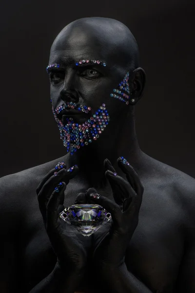 Man in paint and rhinestones — Stock Photo, Image