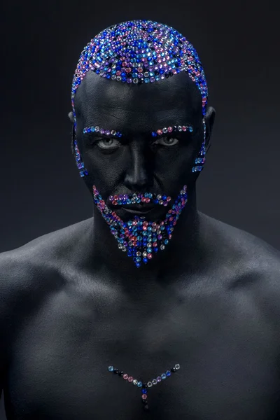 Man in paint and rhinestones — Stock Photo, Image