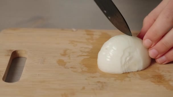 Female Hands Cutting Halved Onion Wooden Chalkboard — Stock Video