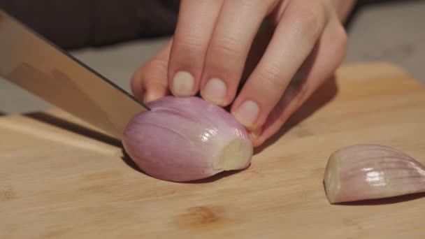 Female Hands Cutting Halved Onion Wooden Chalkboard — Stock Video