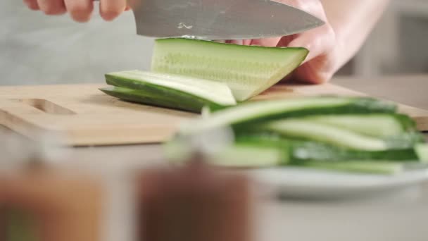 Female Hands Slicing Cucumber Wooden Chalkboard — Stock Video