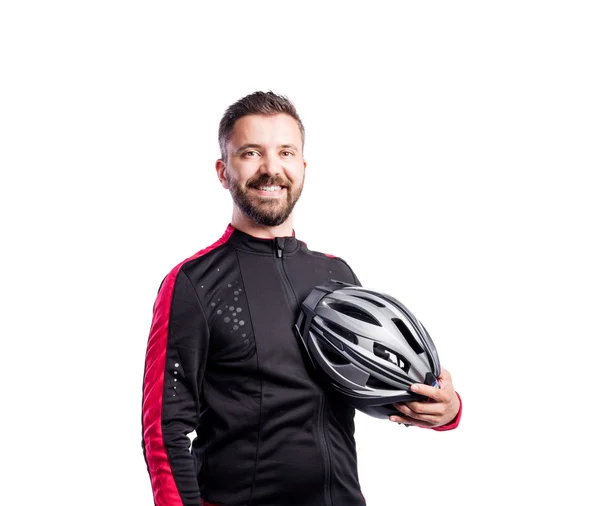 Man in sports sweatshirt holding helmet — Stock Photo, Image