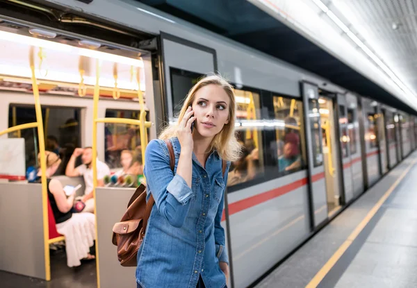 Woman calling  at underground platform — Stock Photo, Image