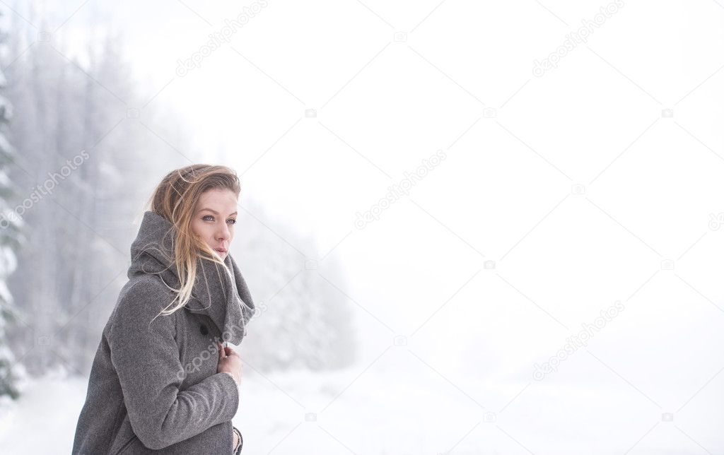 young woman on walk in winter nature