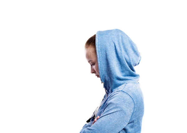 Teenage girl in blue sweatshirt. Studio shot, isolated. — Stock Photo, Image