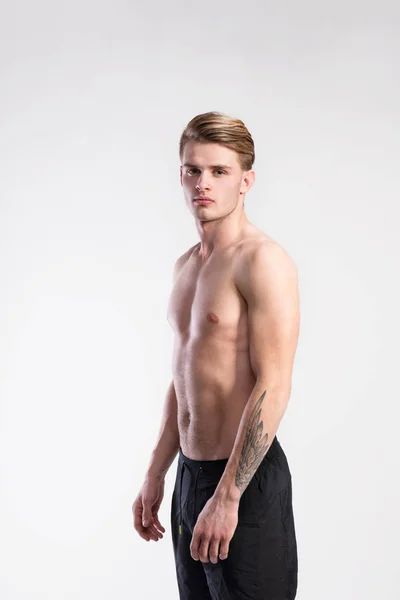 Young handsome hipster shirtless fitness man. Studio shot. — Stock Photo, Image