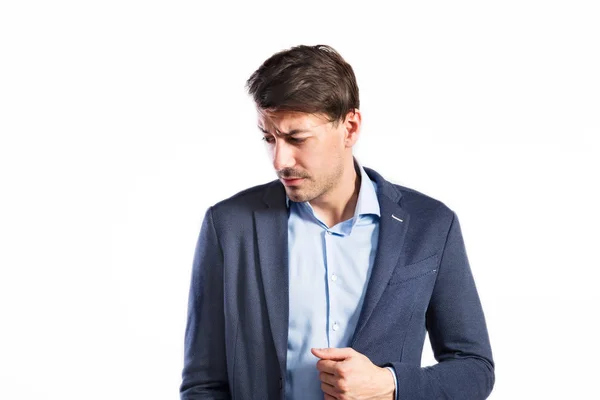 Un joven guapo con chaqueta azul. Captura de estudio, aislada . —  Fotos de Stock