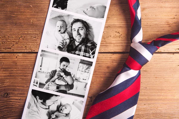 Pictures of father and baby son. Fathers day. Studio shot.