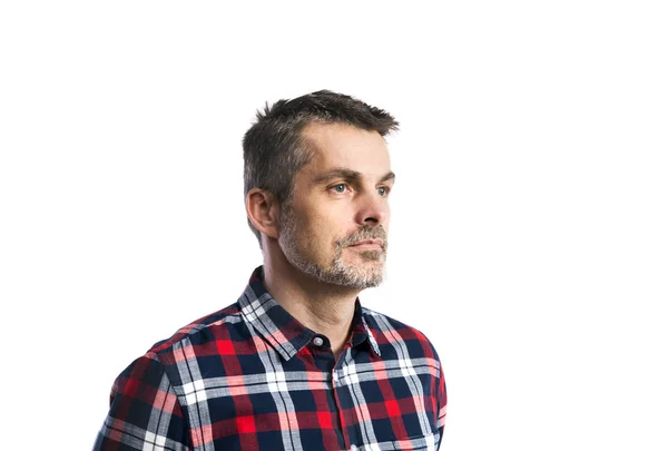 Mature hipster man in checked shirt. Studio shot, isolated. — Stock Photo, Image