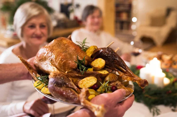 Family celebrating Christmas. Roasted turkey on tray. — Stock Photo, Image