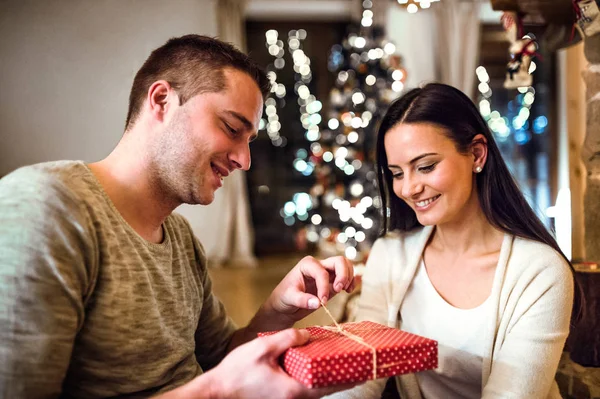 Young couple at Christmas time. — Stock Photo, Image